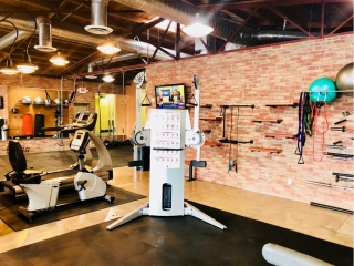 photo 9 of FIIT by Jason Smith facility showing functional training machine, recumbent bike, resistance bands, and stability balls to maximize weight loss and muscle gain in Phoenix, AZ